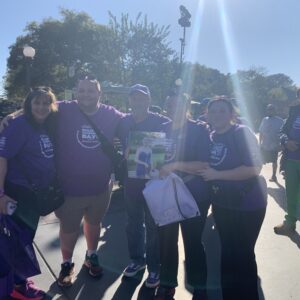 A group of people wearing purple epilepsy awareness tshirts at Epilepsy Awareness Day at Disneyland.